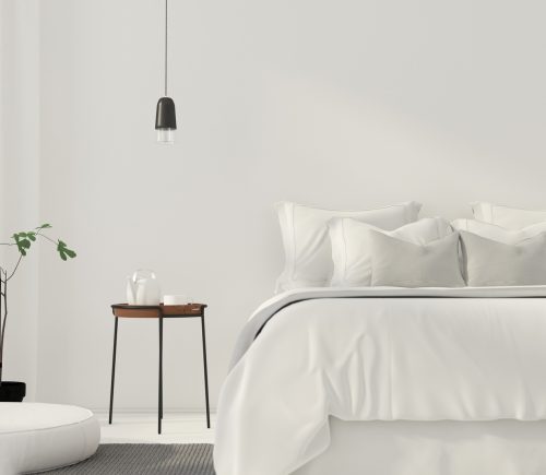 3D illustration. Minimalistic white bedroom with a wooden table